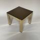 Set of three nesting side tables in brass and smoked mirror.