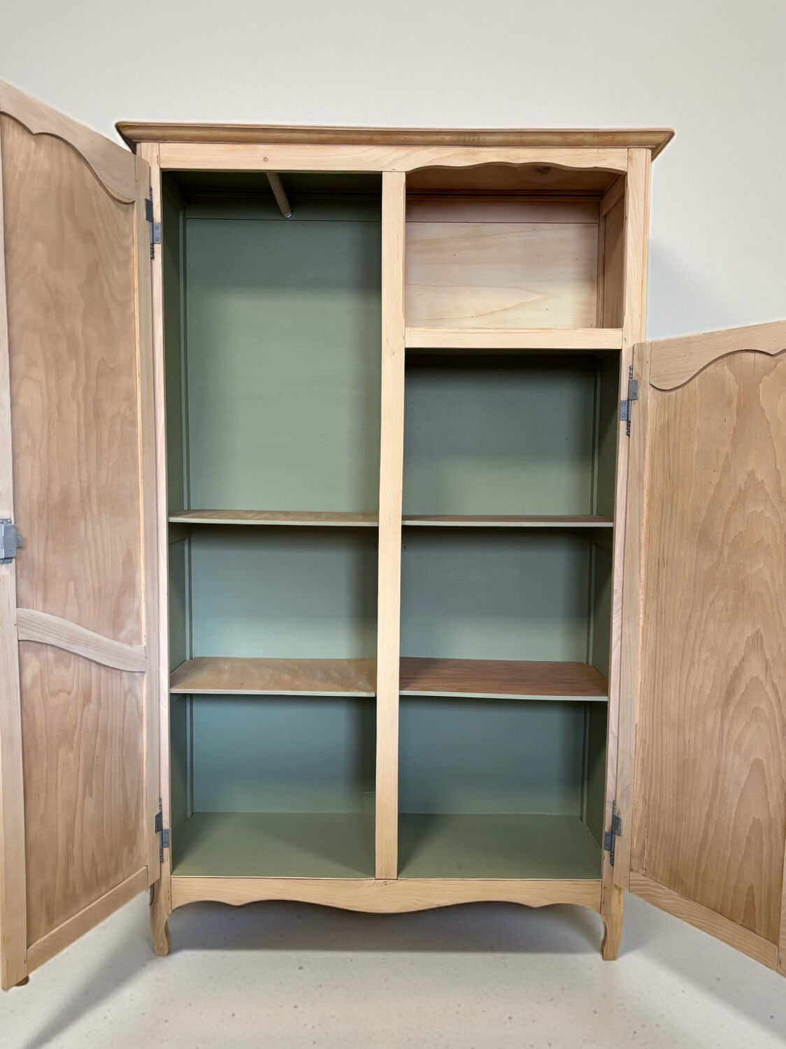 Renovated antique wardrobe – natural wood & sage green interior