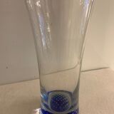 Glass roller vase with blue bubble background