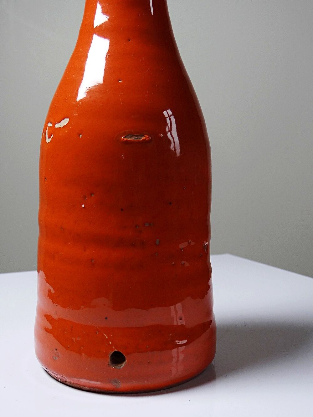 Bright orange mid-century decorative bottle lamp base glazed pottery.