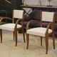 Pair of bridge armchairs in walnut and cream boucle fabric, early 20th century.