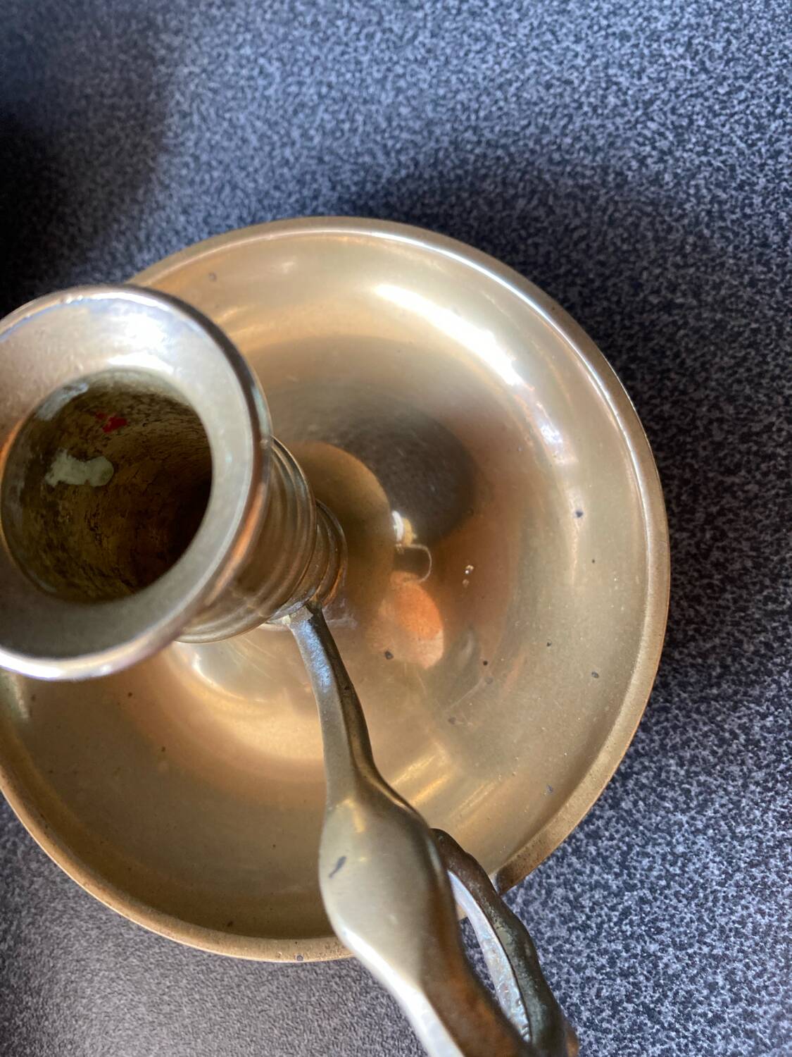 Two brass hand candle holders