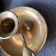 Two brass hand candle holders