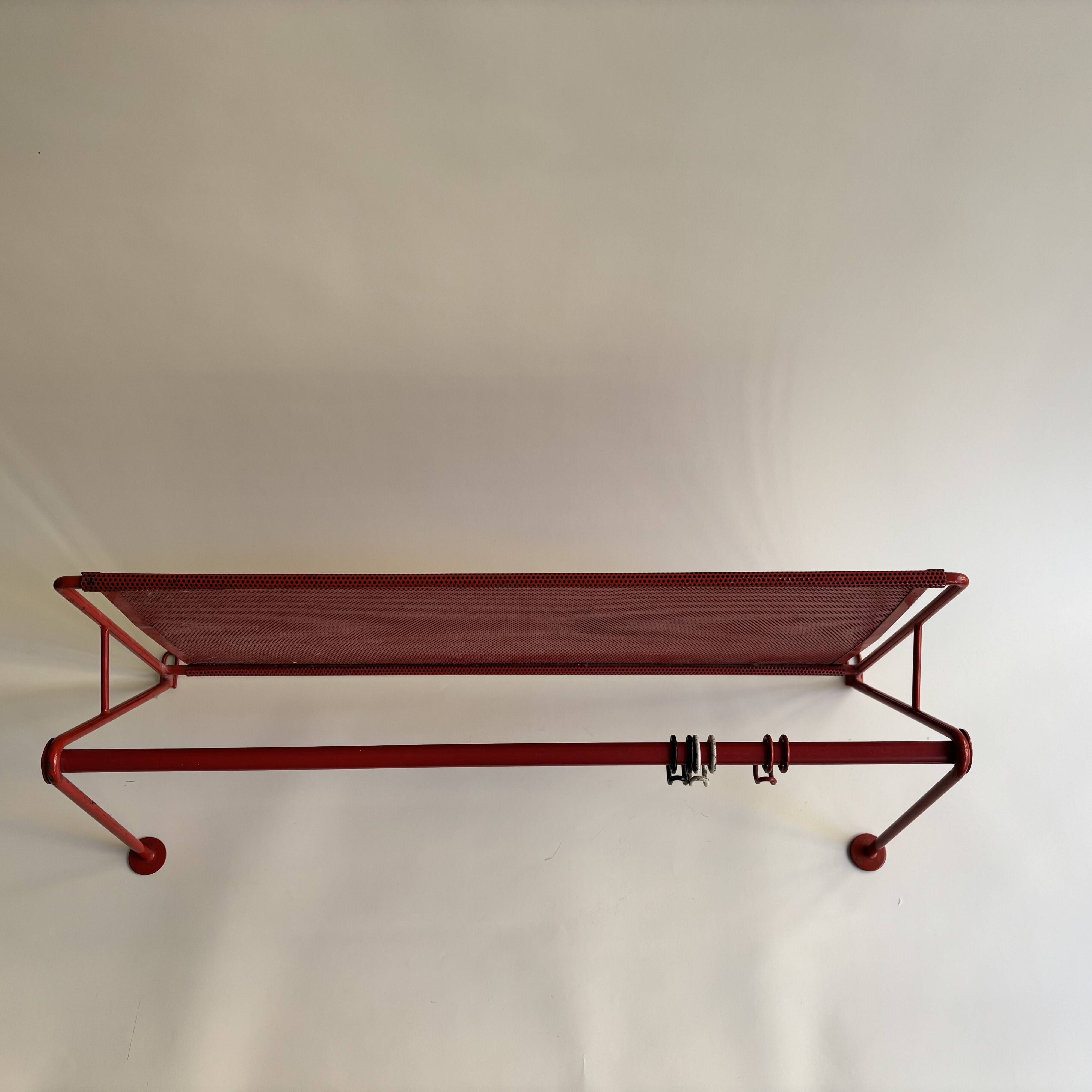 Vintage perforated red metal shelf