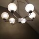 Six-light chrome metal chandelier and opaque glass globes / vintage 60s and 70s