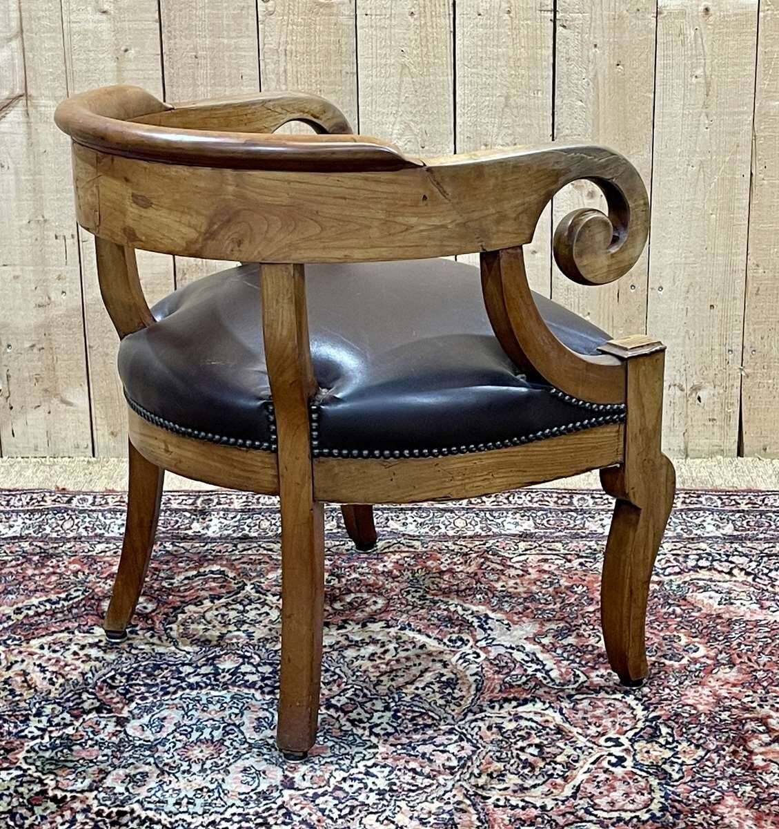 19th century French armchair in cherry wood and leather seat