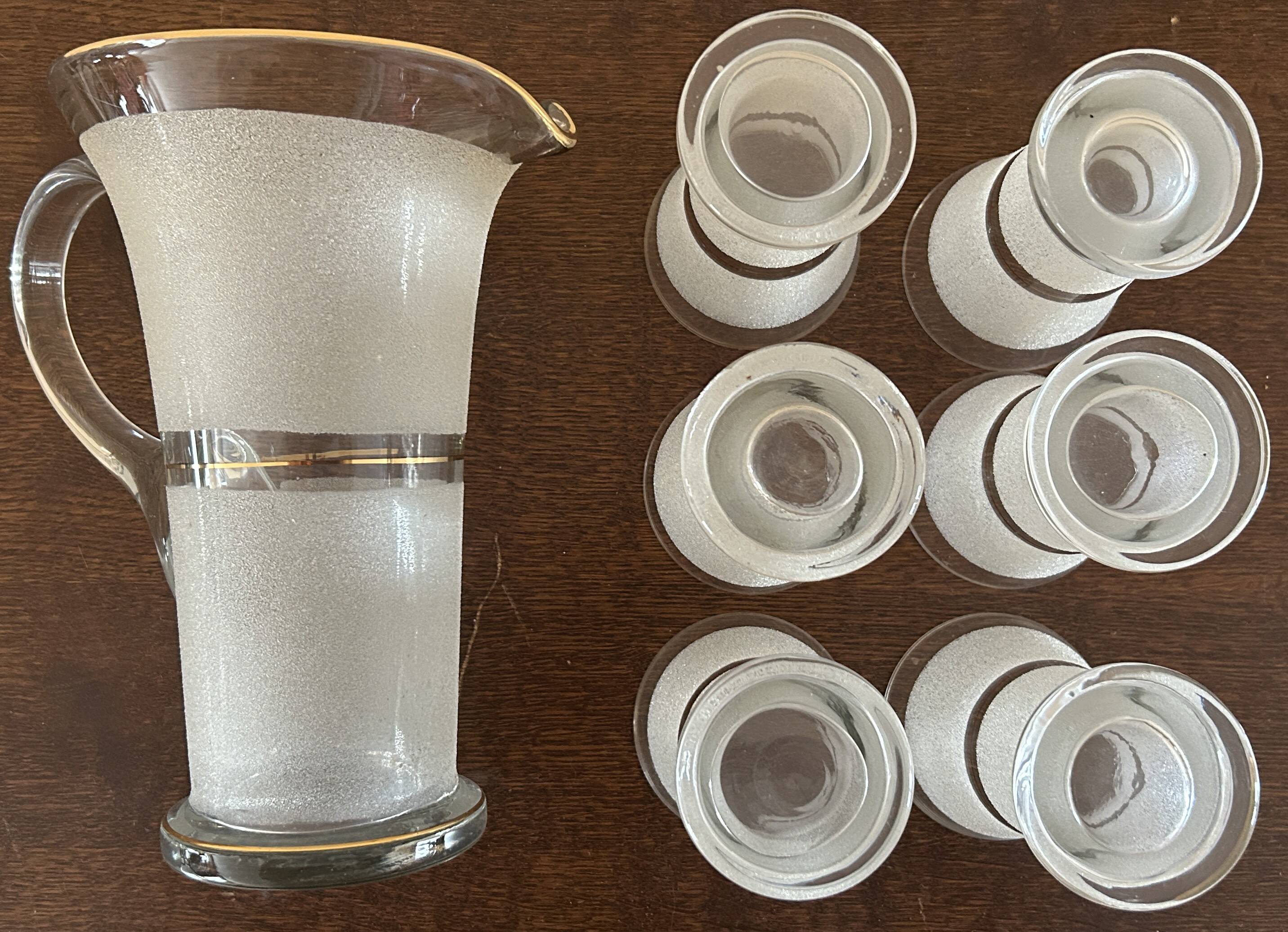 Jug + 6 frosted glass tumblers with white and gold rim.