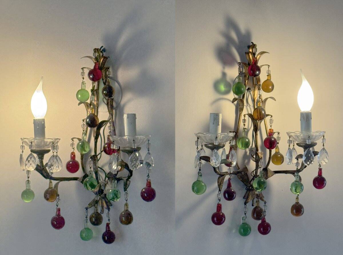 Lustrous chandelier with two wall lights decorated with foliage and pendants.