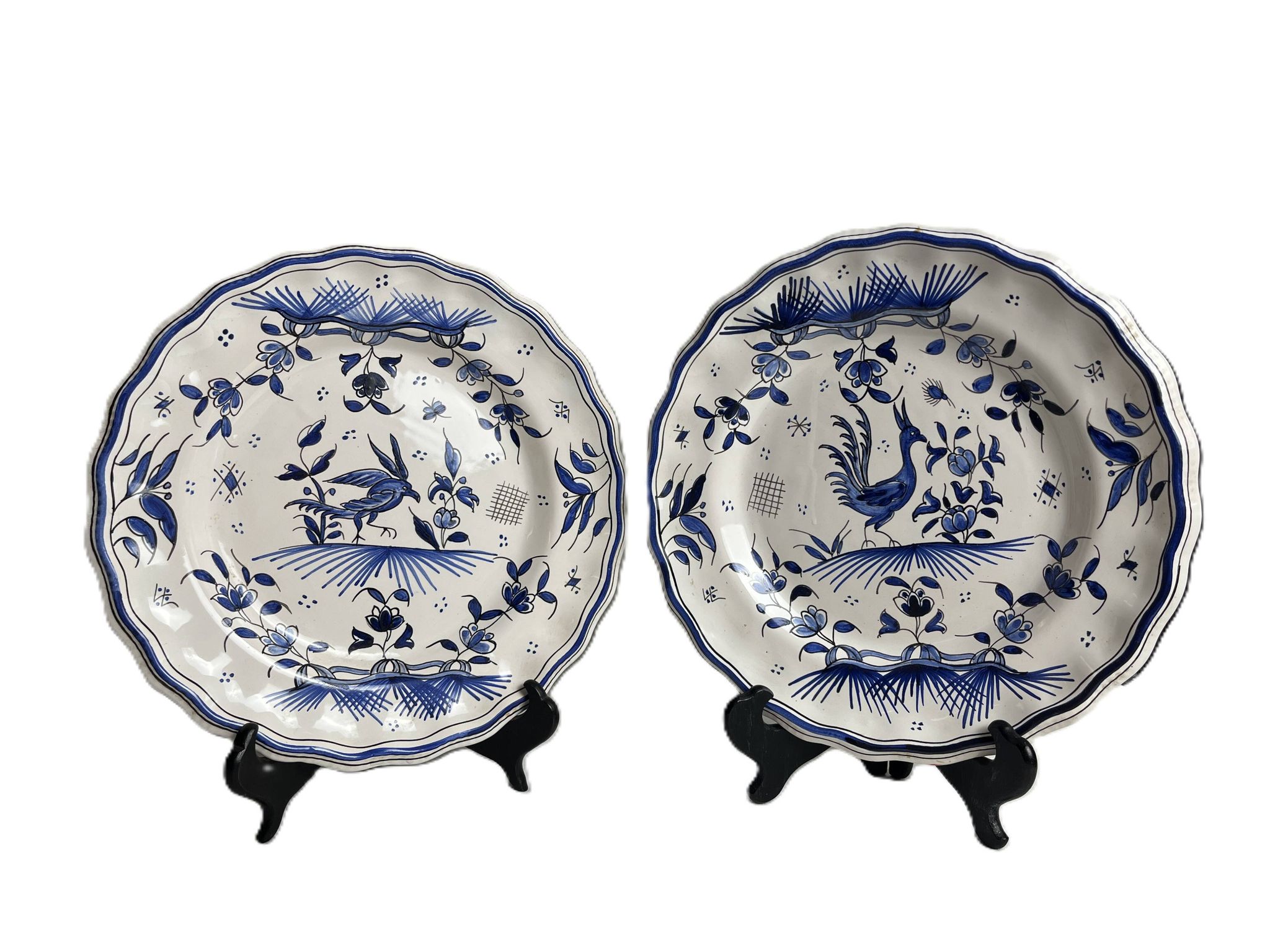 Moustiers, pairs of plates with wading bird design, scalloped edge, early 20th century.