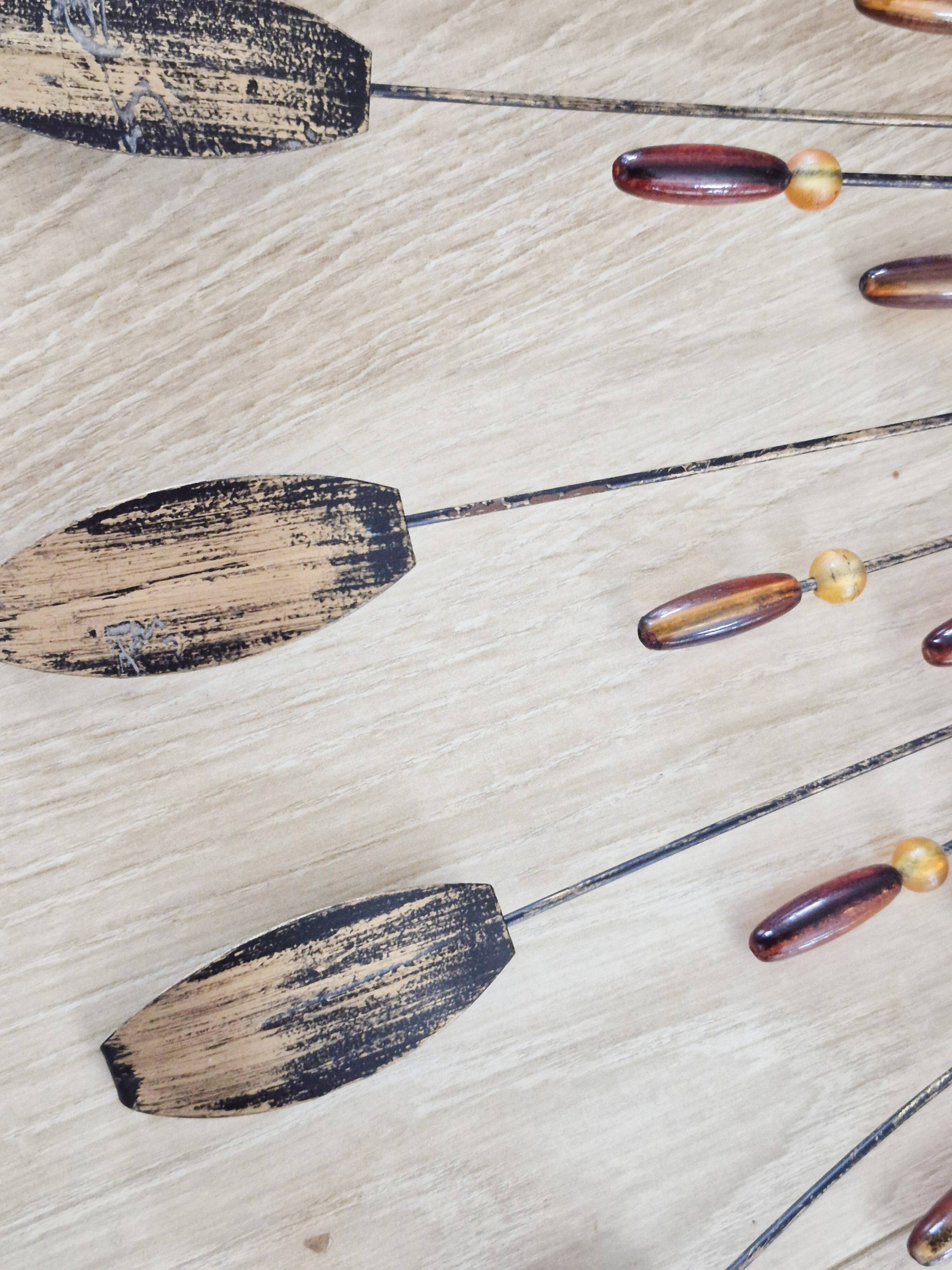 Vintage metal sun mirror in the style of Line Vautrin