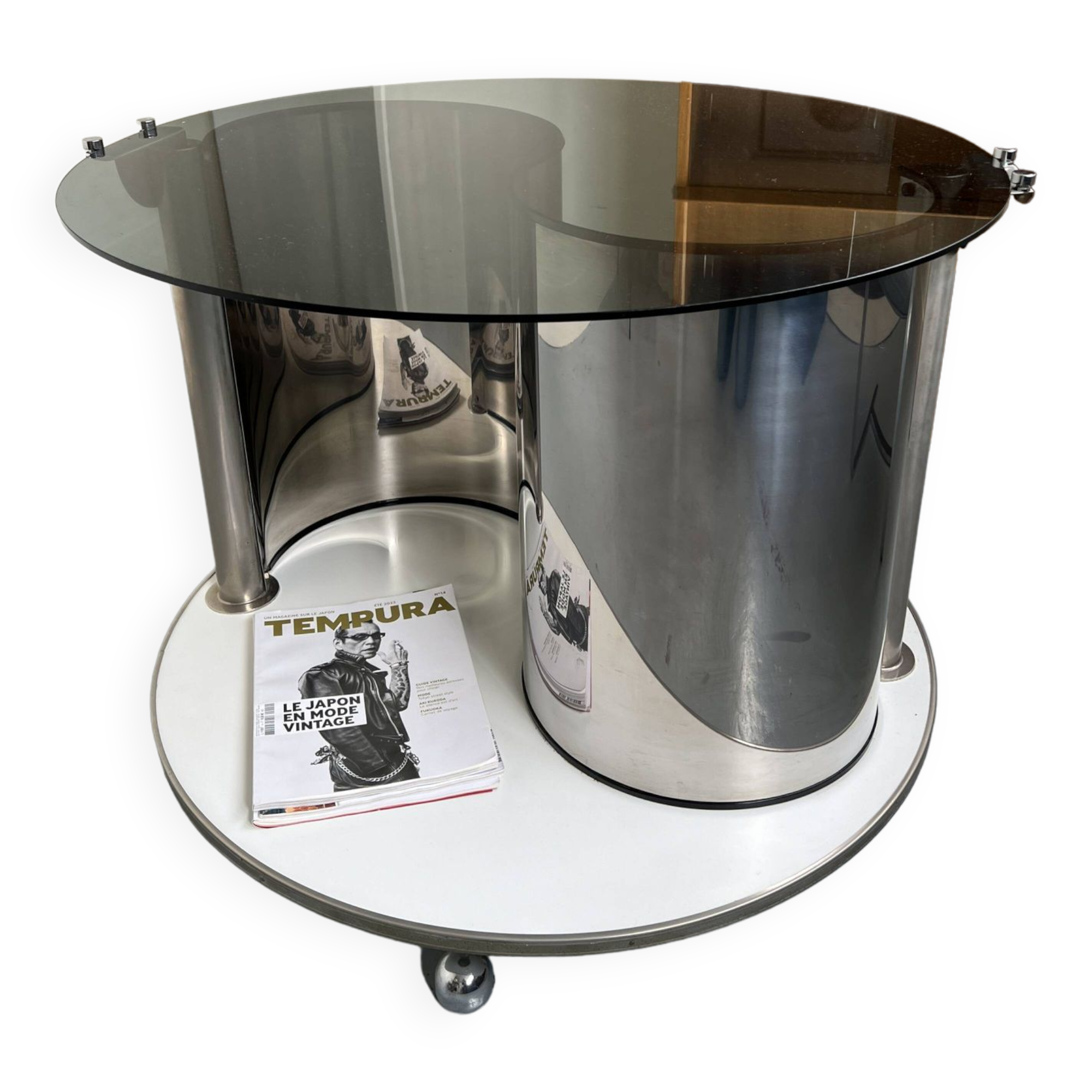 Vintage metal and smoked glass coffee table on casters bar