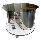 Vintage metal and smoked glass coffee table on casters bar