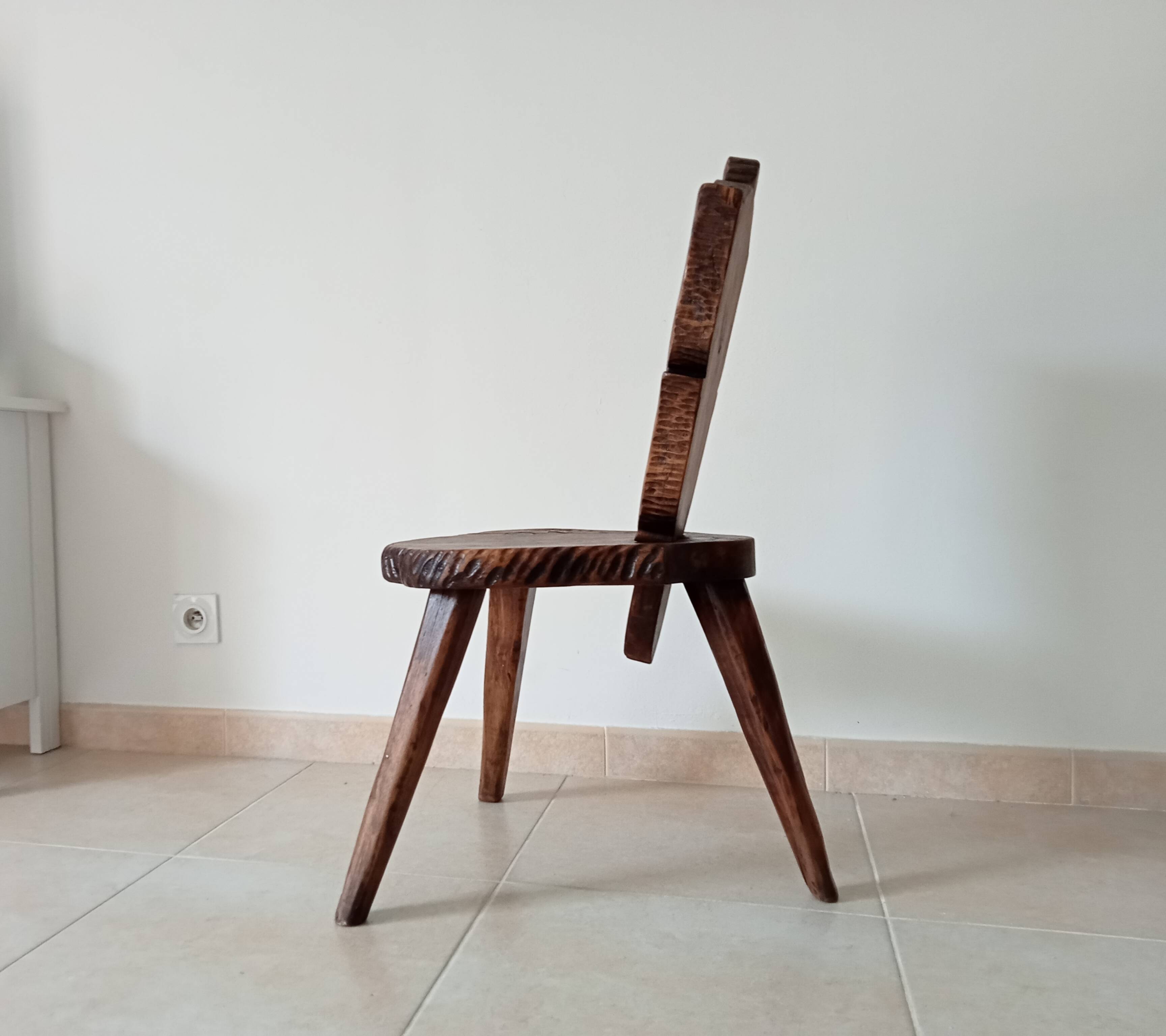 Brutalist tripod chair in carved wood 19th century