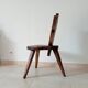 Brutalist tripod chair in carved wood 19th century