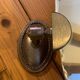 Adjustable oval beveled mirror