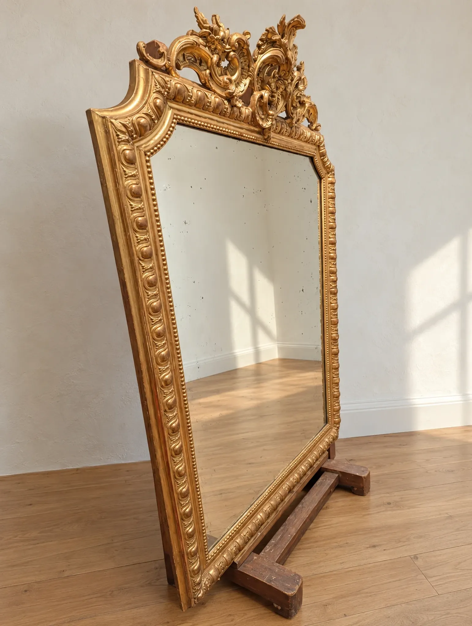 Large antique gilded mirror in Louis XV style