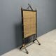 Antique black and gold faux bamboo fireplace screen