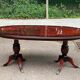 Glossy mahogany dining table in English Regency style from the 1970s.