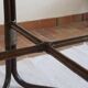 Round dining table in rattan, smoked glass top, 1970s.