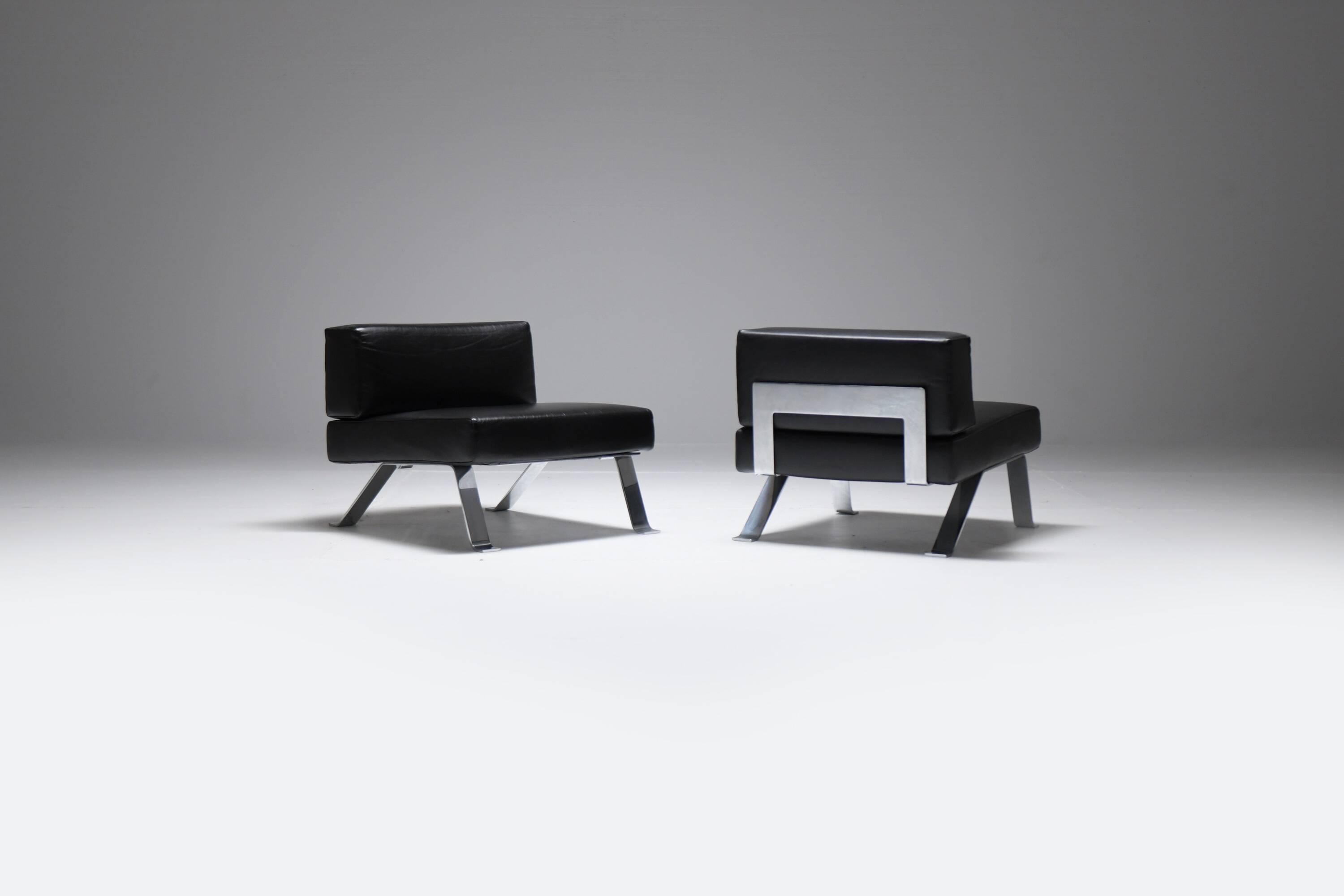 Black leather Ombra 512 lounge chairs by Charlotte Perriand for Cassina Italy