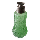 Small green bottle and old metal, single-flower vase