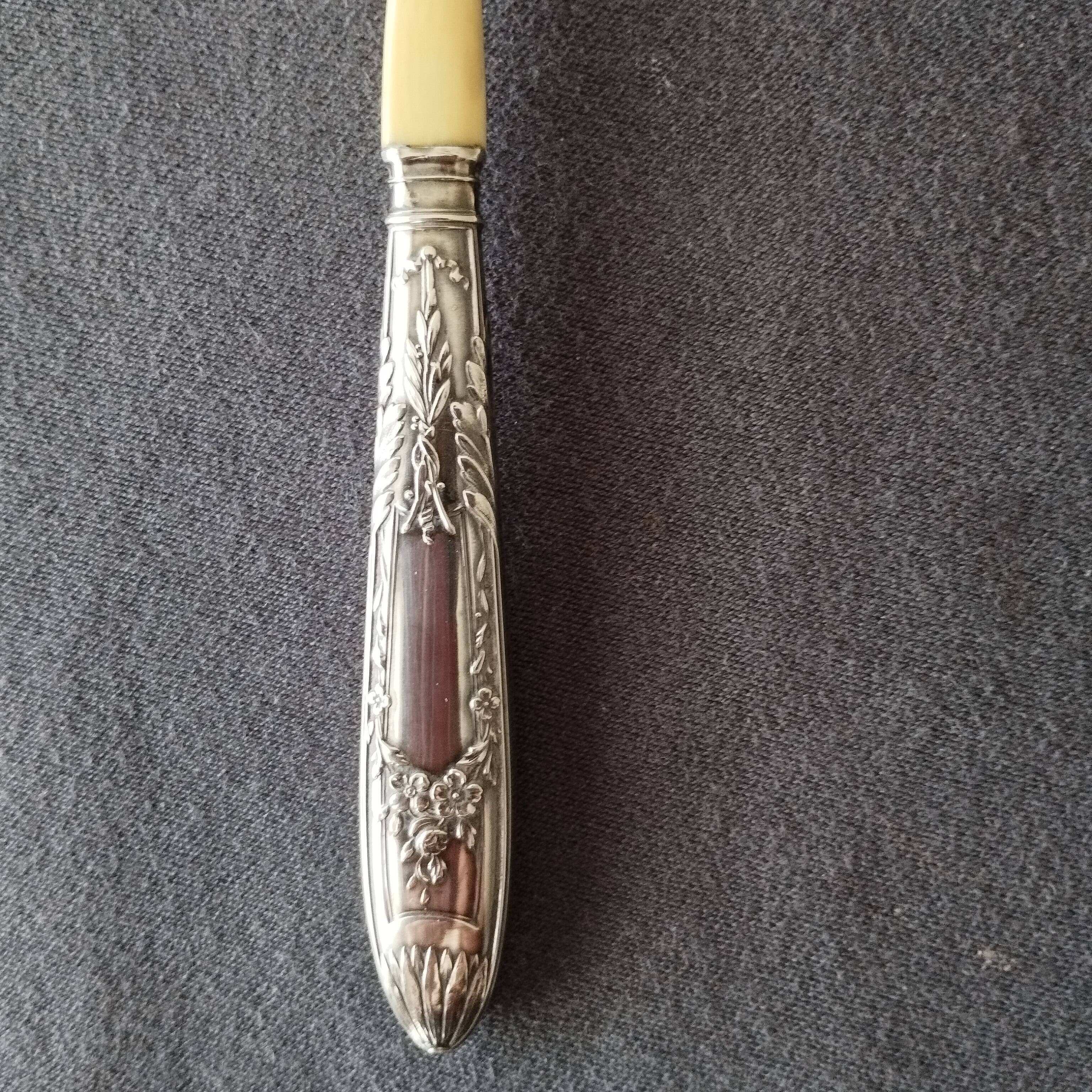 silver-plated baby feeding spoon