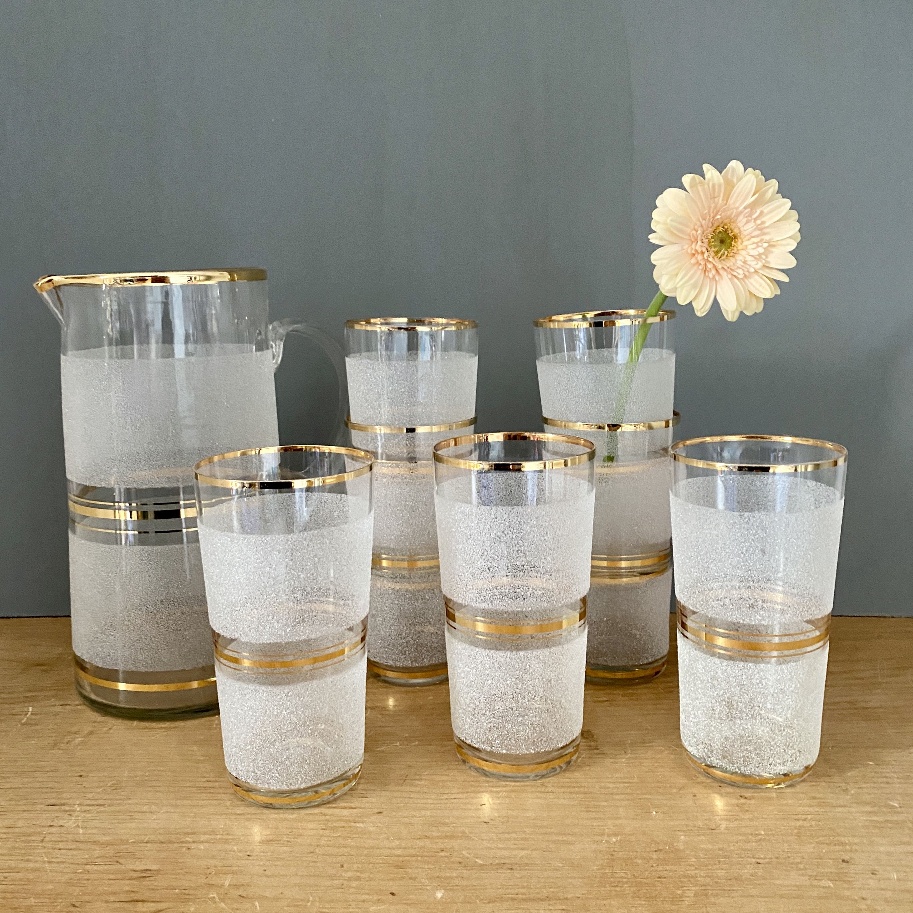 Vintage orangeade service in white granite glass and golden edging