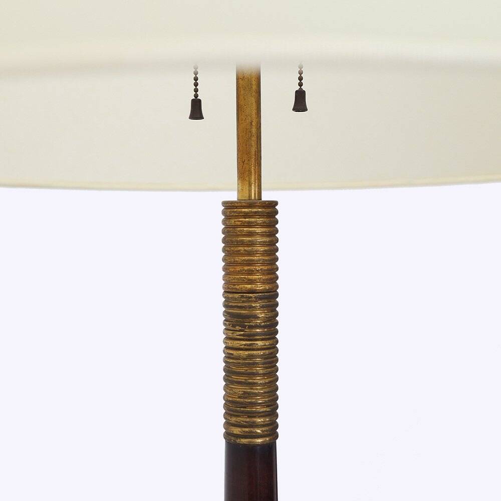 Floor lamp with a brass base and parchment shade, 1940s.