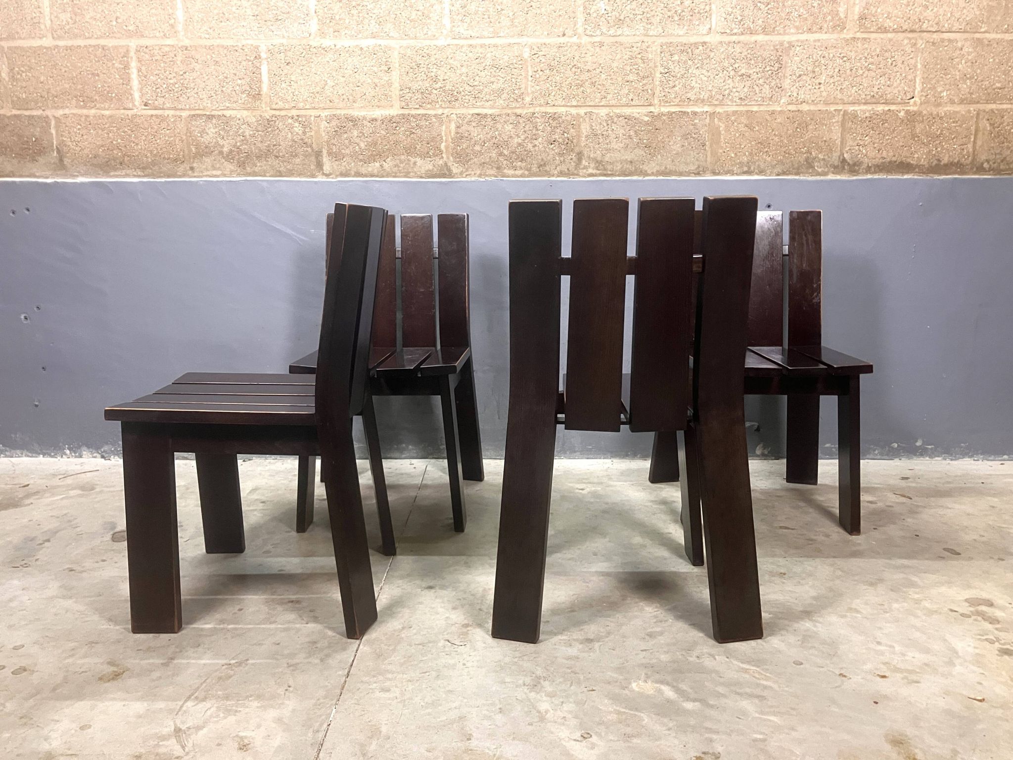 Brutalist and modernist dining chairs from the 1970s in architectural brown wood.