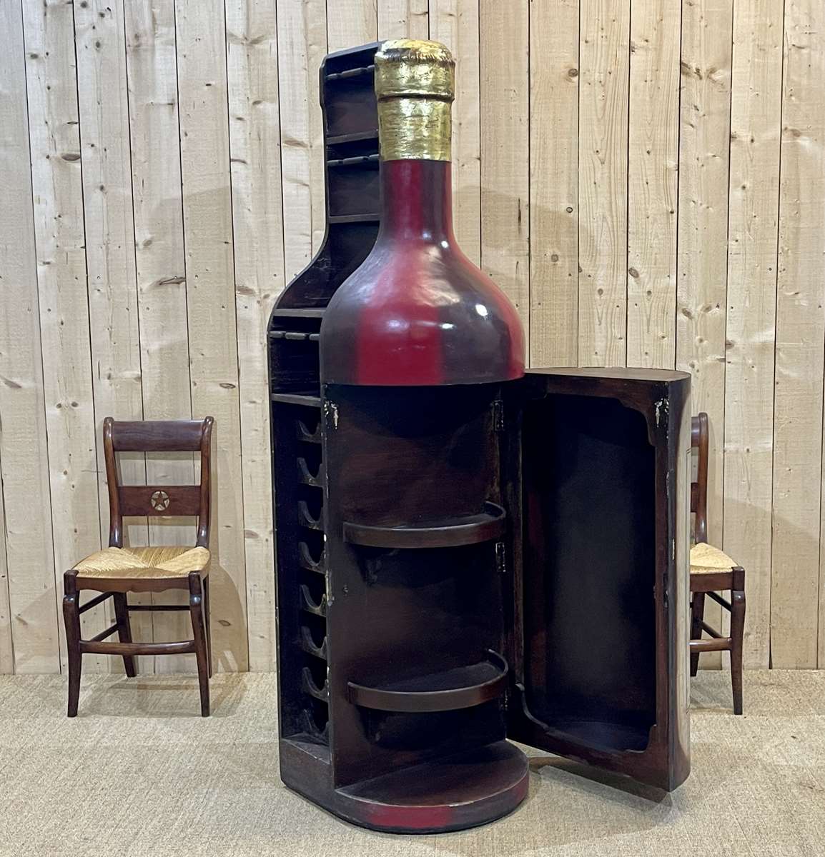 Advertising bar furniture in the shape of a giant wine bottle 90s
