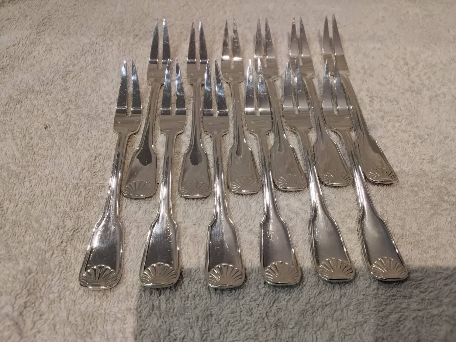 12 silver-plated metal snail forks by silversmith Noel Collet, shell design