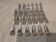 12 silver-plated metal snail forks by silversmith Noel Collet, shell design