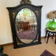 Large old trumeau mirror in black and gilded wood Napoleon style