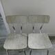 Pair of chairs in Formica effect wood veins and golden singing
