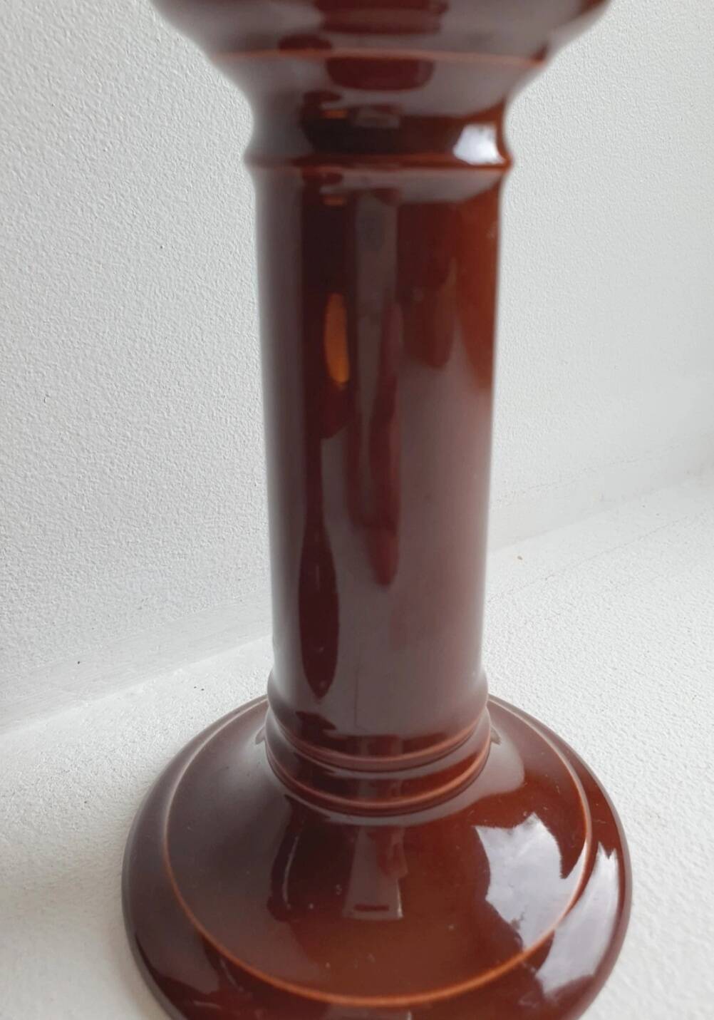 Pair of English brown ceramic candlesticks. Circa 2003, designed by S.