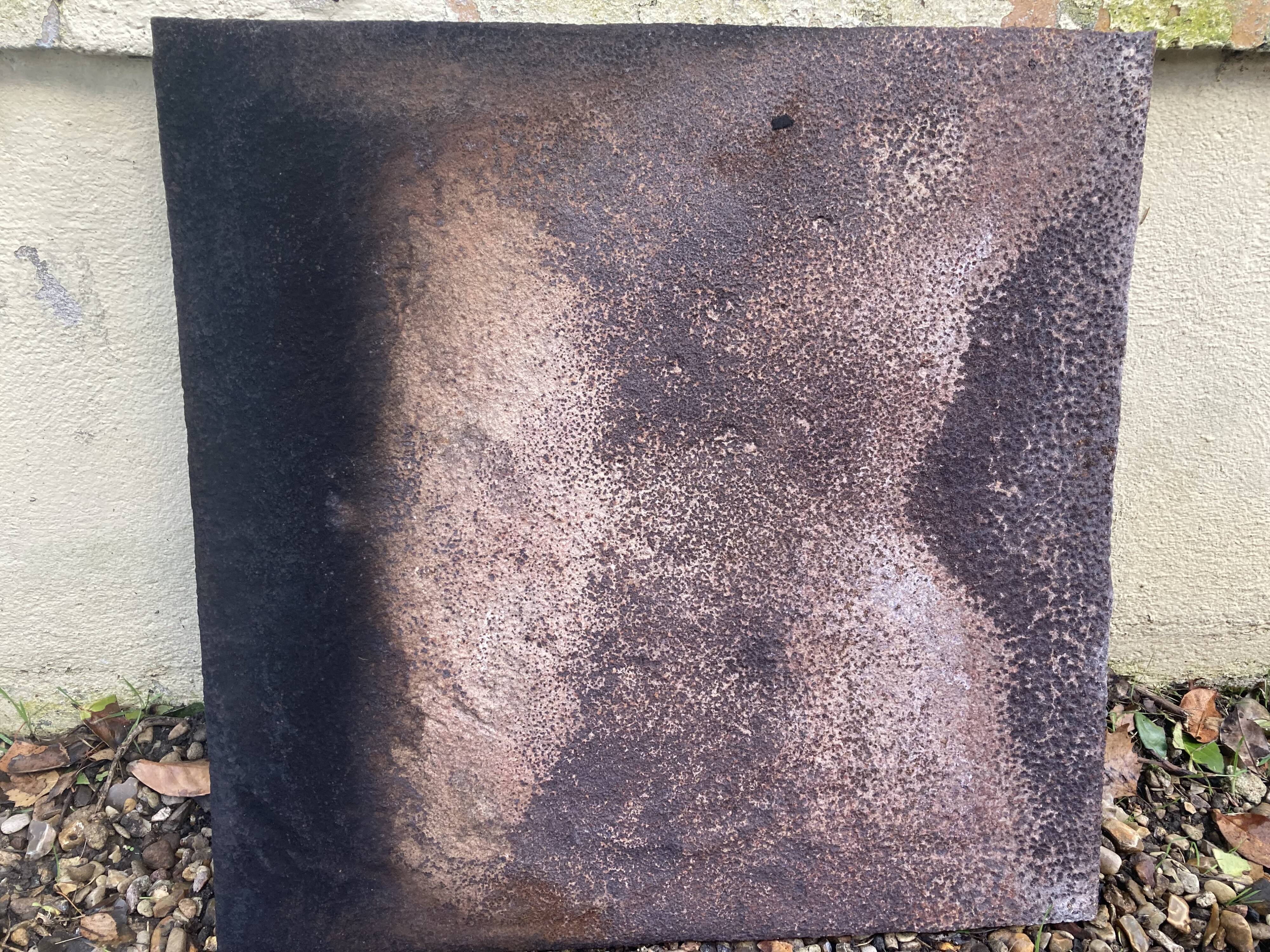 Old cast iron fireback with royal coat of arms