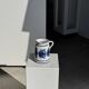 Artisan blue floral decorative carafe, height 17 cm, diameter 24.5 cm.
