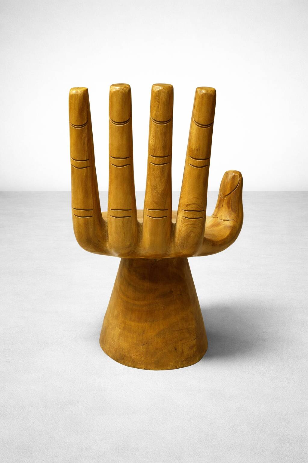 Sculptural armchair in solid wood – hand shape