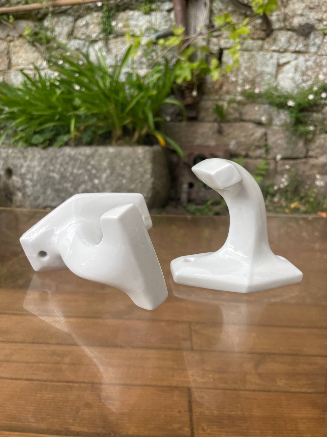 Duo of porcelain hooks