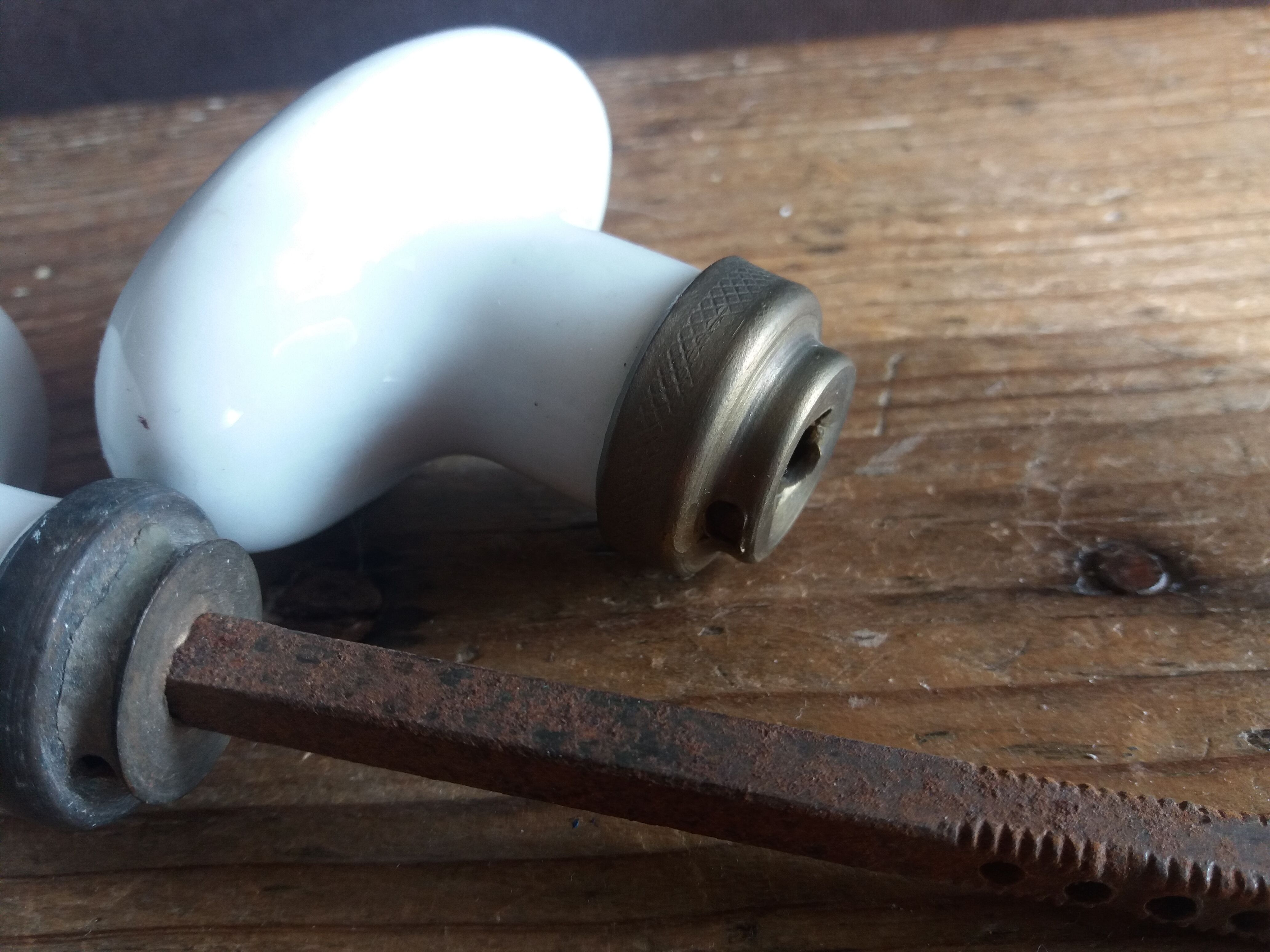 White porcelain door knob handles