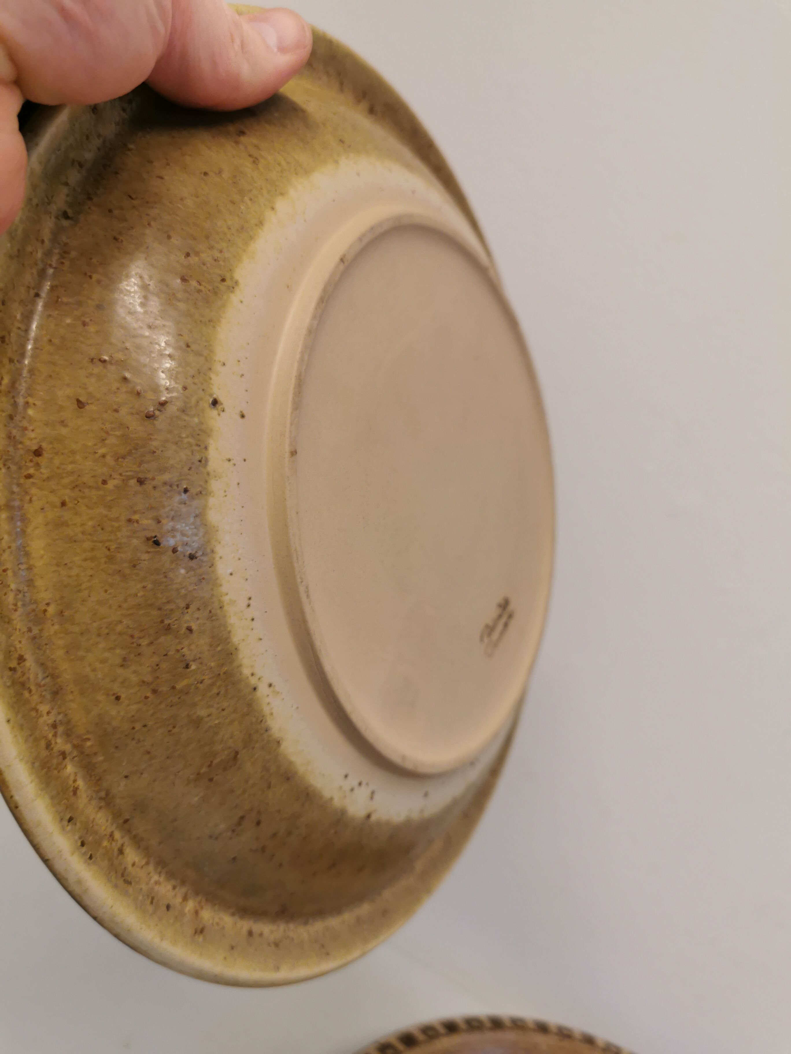 Ceramic plates, designed and made by Danish Ravnild (both stamped and signed)