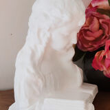 Plaster bust reading child