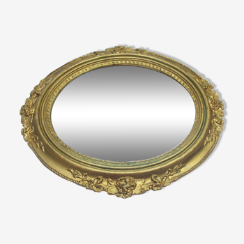 Old mirror in a decorated frame, 1960's 45x42cm