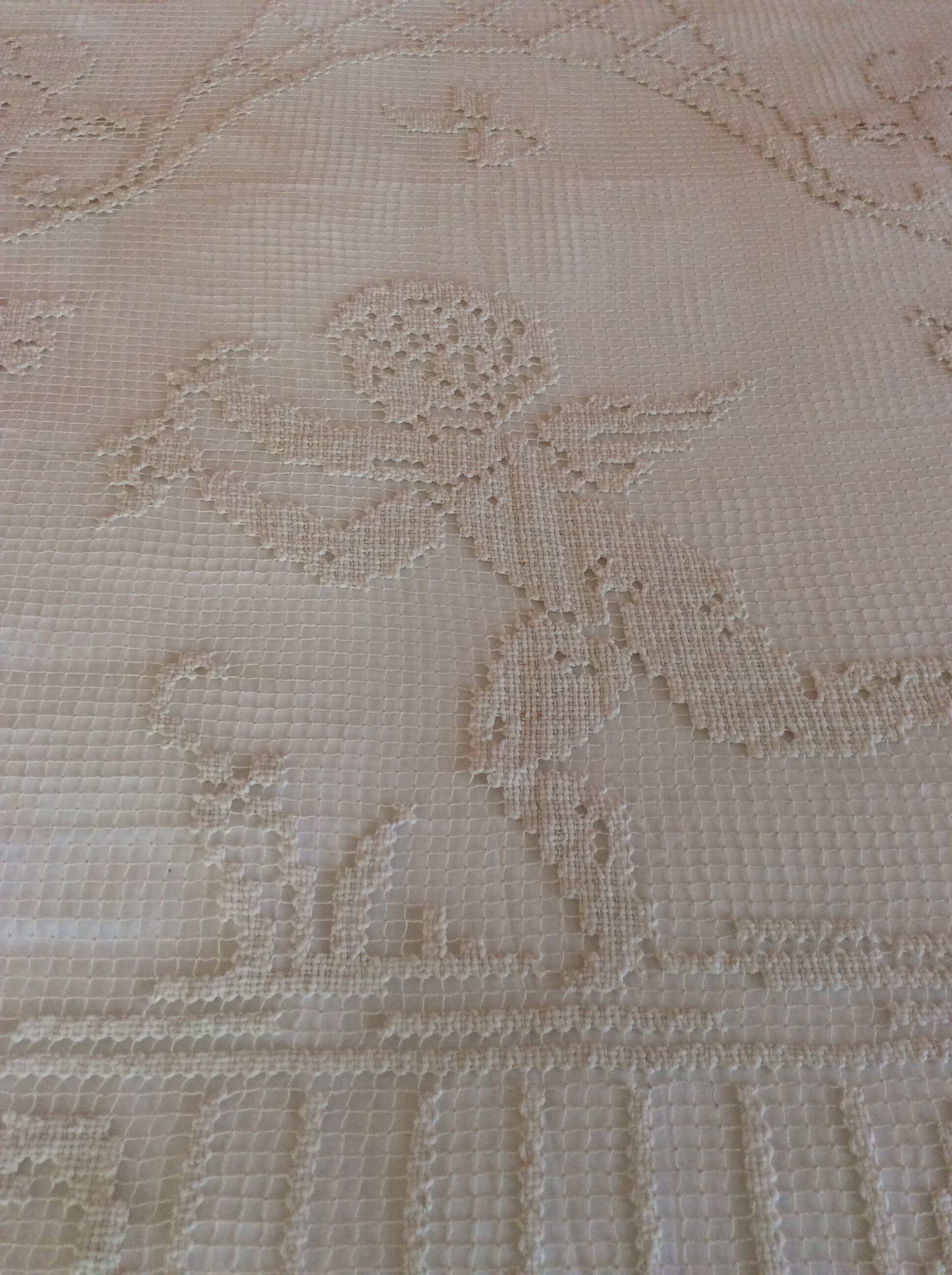 Old bedspread with angel embroidery