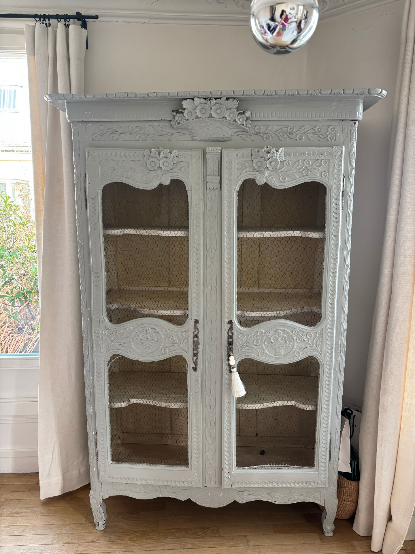 Antique French carved display cabinet with wire mesh doors