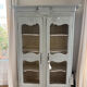 Antique French carved display cabinet with wire mesh doors
