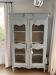 Antique French carved display cabinet with wire mesh doors