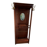 Antique wooden coat rack with mirror and shelf.
