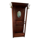 Antique wooden coat rack with mirror and shelf.