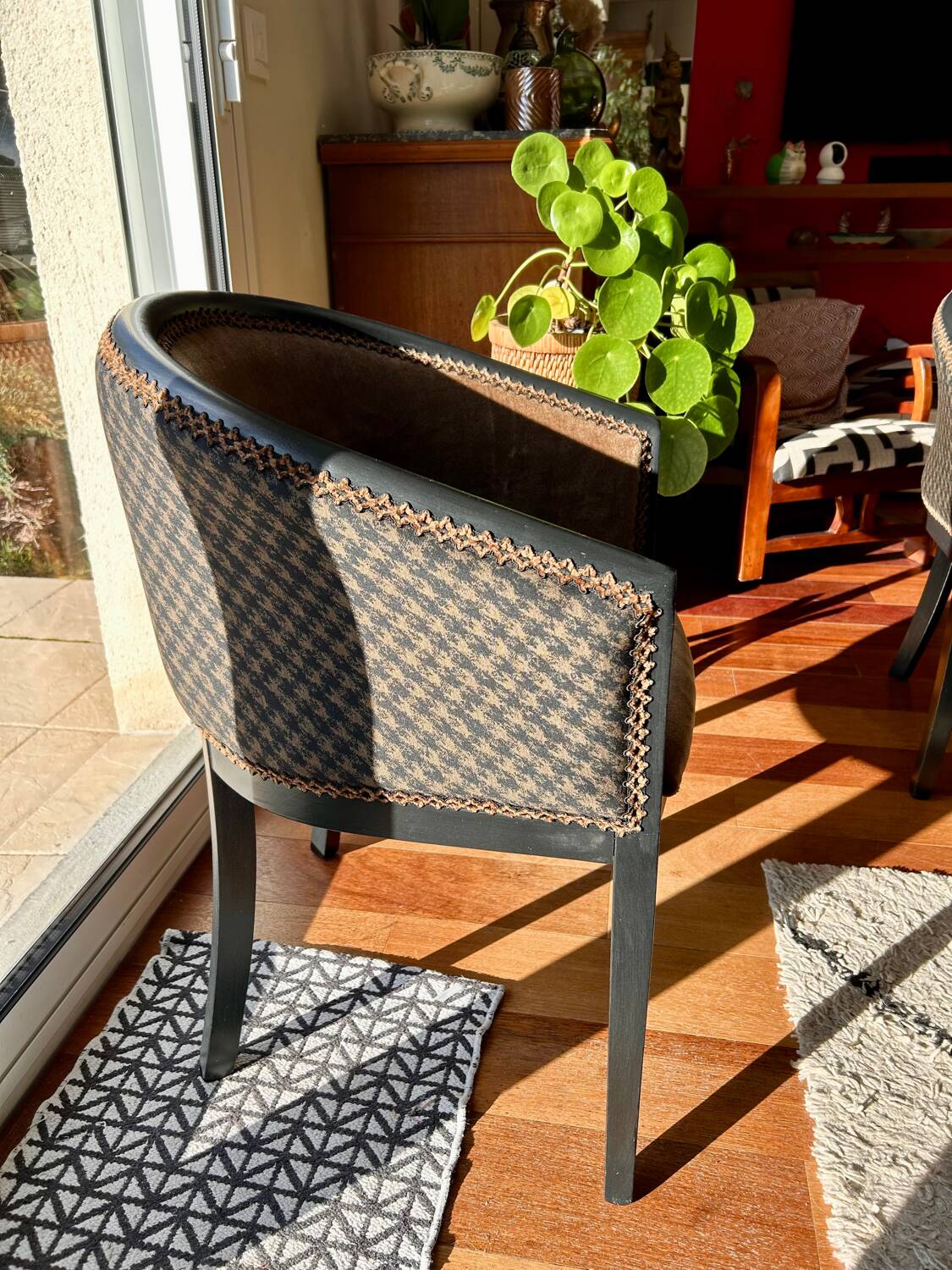 Pair of Art Deco barrel chairs in black and bronze